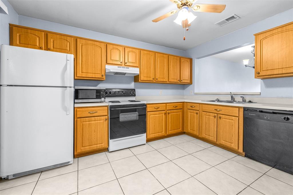 5100 Burchette Road, Unit 4102 Tampa, FL 33647 - Photo 11 of 47 a kitchen with a sink cabinets and window