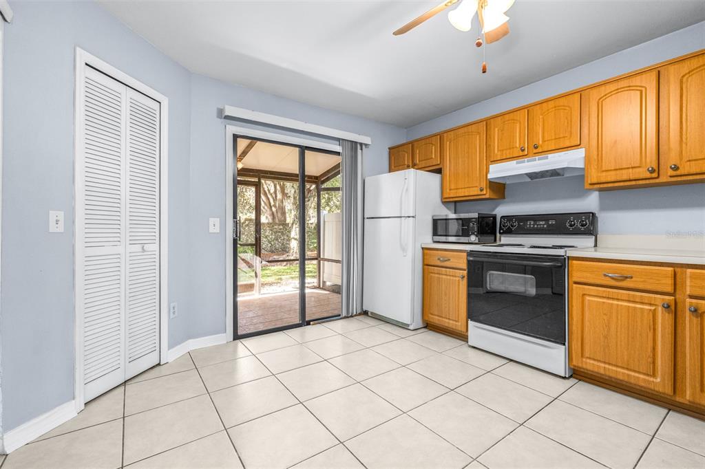 5100 Burchette Road, Unit 4102 Tampa, FL 33647 - Photo 15 of 47 a kitchen with stainless steel appliances granite countertop a stove a sink and a refrigerator