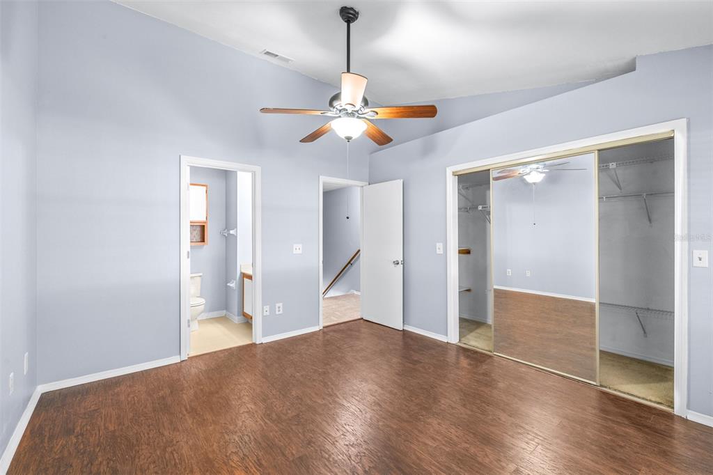 5100 Burchette Road, Unit 4102 Tampa, FL 33647 - Photo 20 of 47 a bedroom with a bed and wooden floor