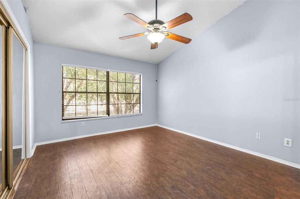 5100 Burchette Road, Unit 4102 Tampa, FL 33647 - Photo 22 of 47 an empty room with wooden floor and windows