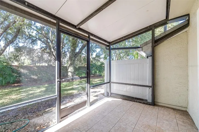 a view of a room with large windows and a table
