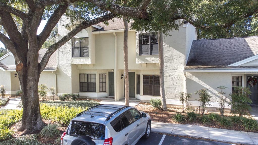 5100 Burchette Road, Unit 4102 Tampa, FL 33647 - Photo 38 of 47 a front view of house with yard outdoor seating and large tree