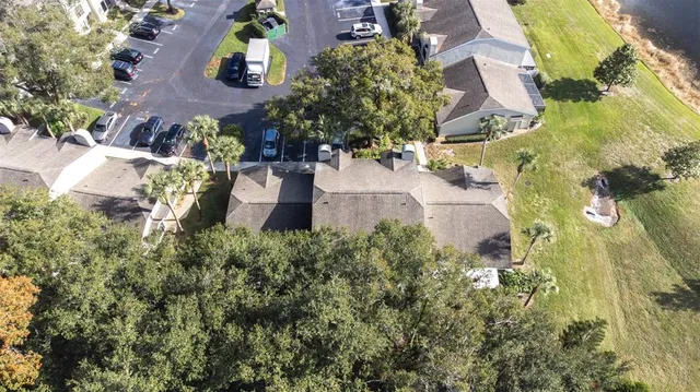 an aerial view of a house with a yard