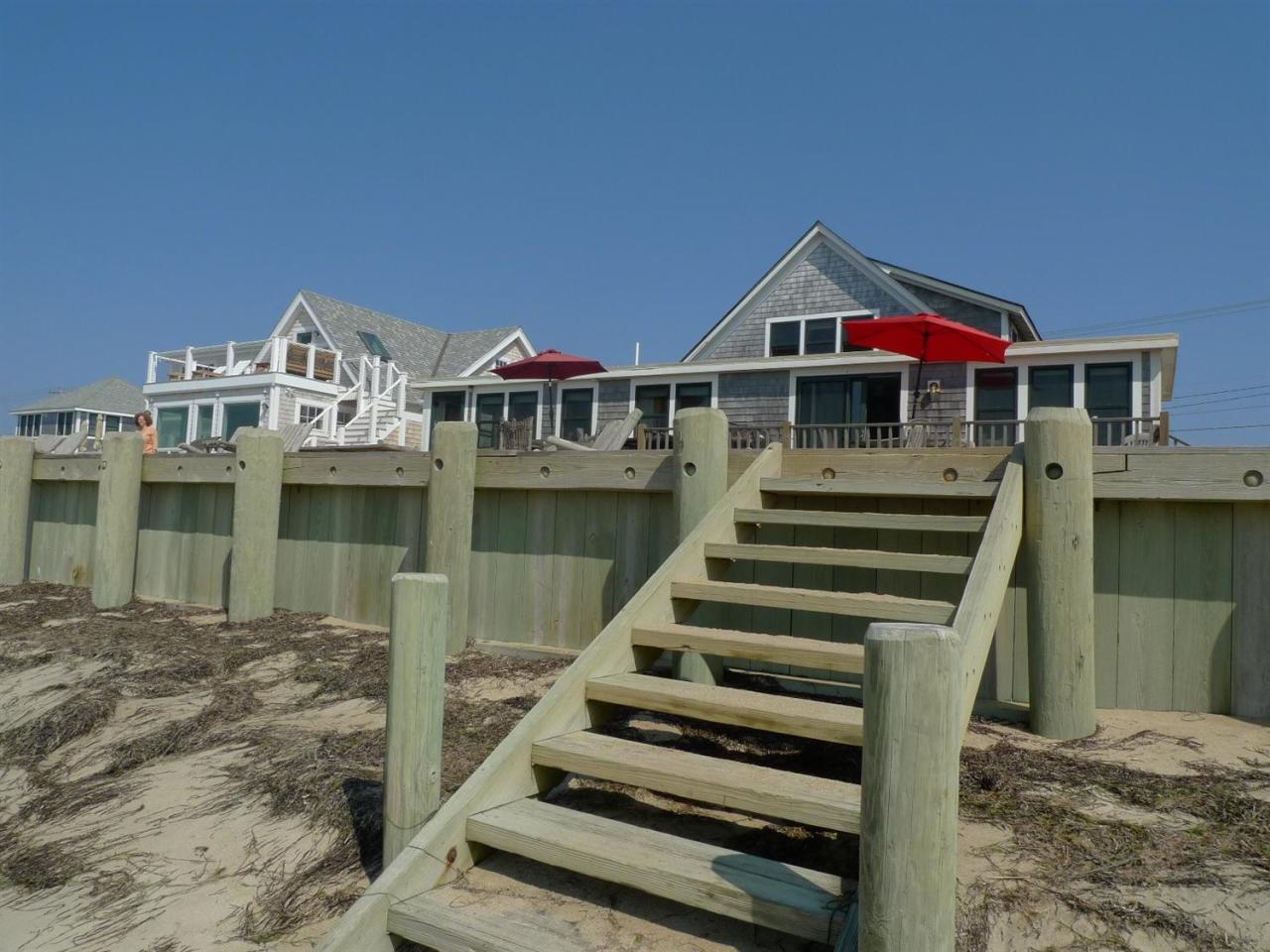 522 Shore Road, Unit 4 Truro, MA 02666 - Photo 7 of 12 a front view of a house with wooden stairs and a sink