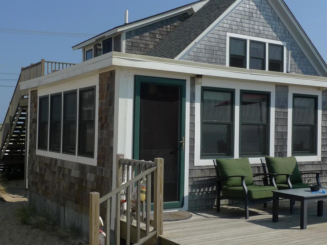 522 Shore Road, Unit 4 Truro, MA 02666 - Photo 8 of 12 a view of house with chairs and table in it