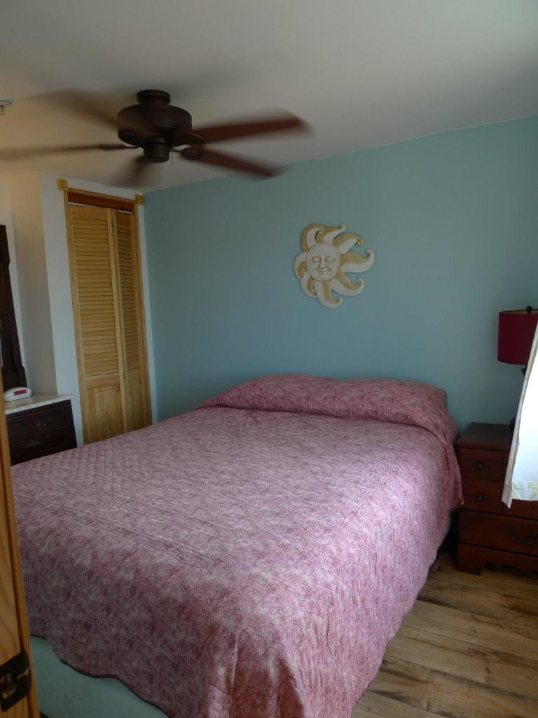 522 Shore Road, Unit 4 Truro, MA 02666 - Photo 9 of 12 a bed sitting in a bedroom next to a window