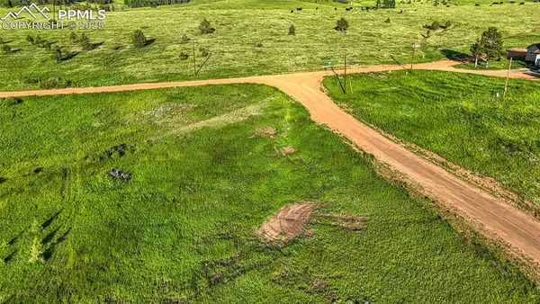 a view of a lake with a building in the background