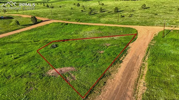 a view of a lake with a yard