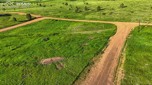 a view of a big yard with houses