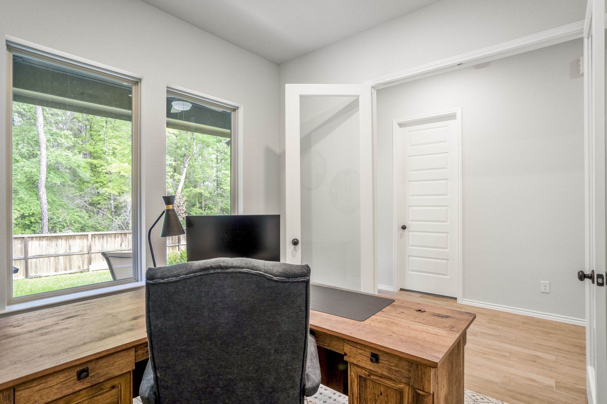334 Topper Pines Drive Montgomery, TX 77316 - Photo 24 of 49 Looking back from the study, the French doors open to the hallway with the primary suite just across the way, making this work-from-home space easy to access while still feeling set apart from the main living area.