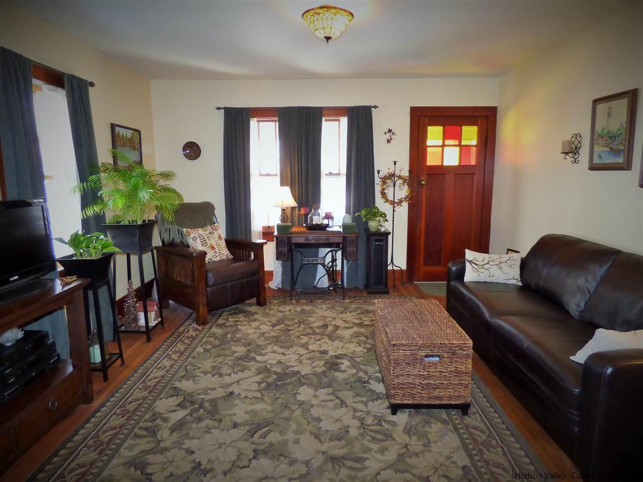 21 Crittenden Street Wallkill, NY 12589 - Photo 12 of 28 a living room with furniture and a flat screen tv