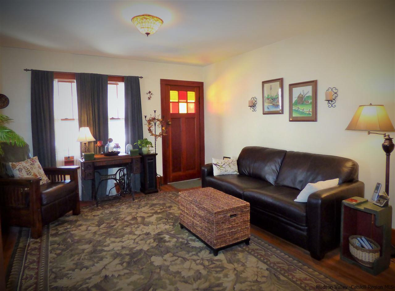 21 Crittenden Street Wallkill, NY 12589 - Photo 13 of 28 a living room with furniture a couch and wooden floor