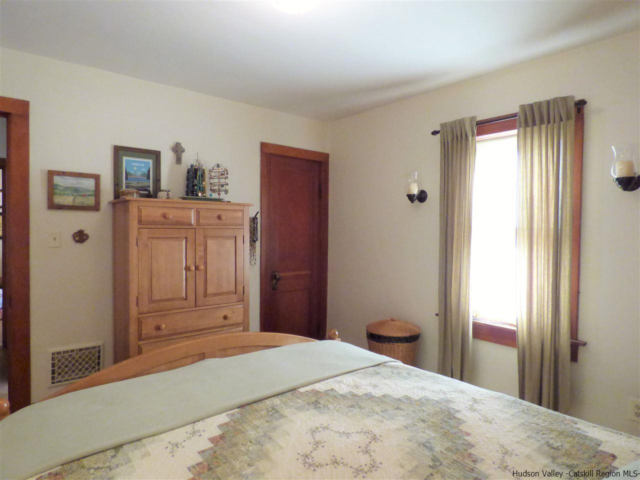 21 Crittenden Street Wallkill, NY 12589 - Photo 15 of 28 a bedroom with a bed and a window