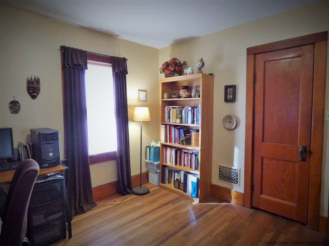 21 Crittenden Street Wallkill, NY 12589 - Photo 19 of 28 a livingroom with a book shelf and a closet
