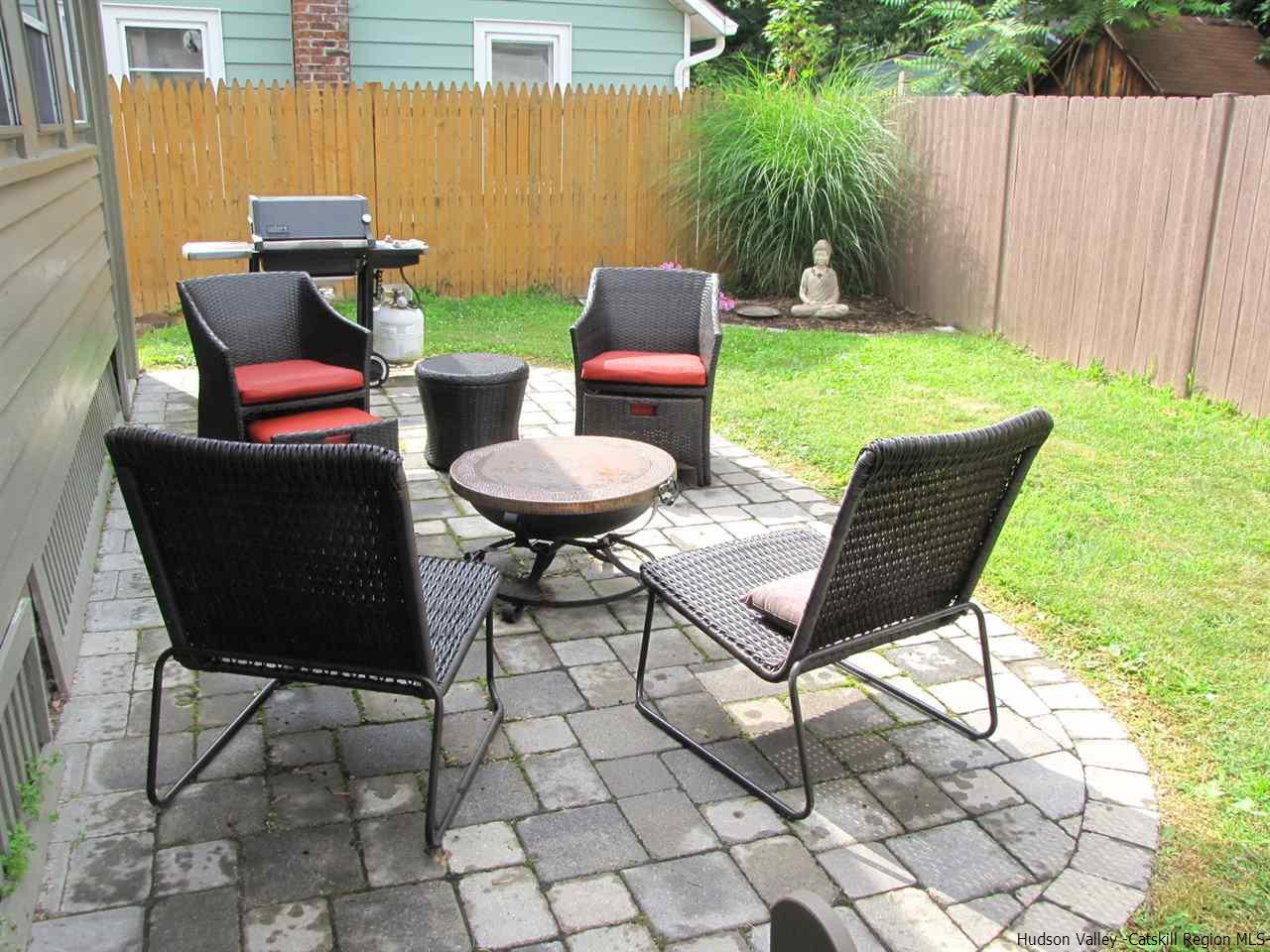 21 Crittenden Street Wallkill, NY 12589 - Photo 2 of 28 a view of a chairs and table in the back yard of a house with a chairs