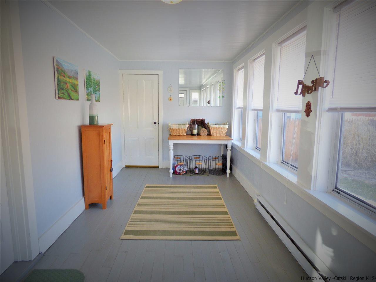 21 Crittenden Street Wallkill, NY 12589 - Photo 3 of 28 a bed room with a bed and a window