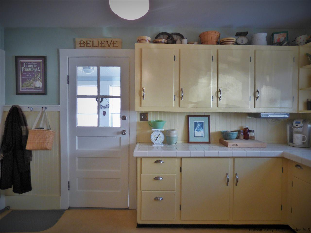 21 Crittenden Street Wallkill, NY 12589 - Photo 8 of 28 a view of cabinets and wooden floor