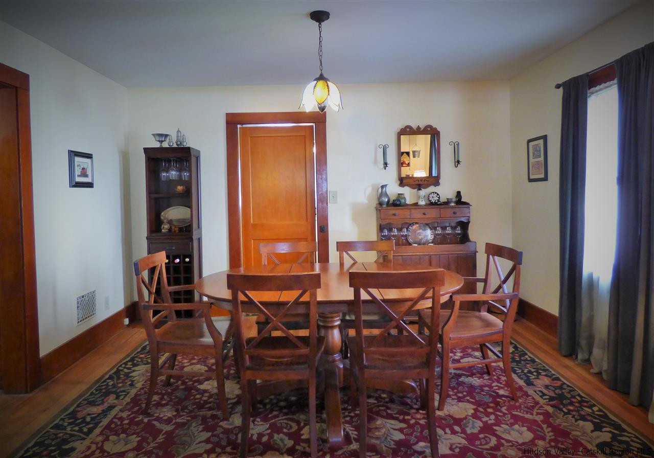 21 Crittenden Street Wallkill, NY 12589 - Photo 10 of 28 a dining room with furniture window and wooden floor