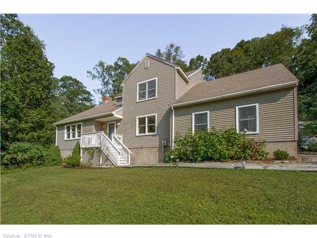 185 Dunk Rock Road Guilford, CT 06437 - Photo 1 of 1 a front view of a house with a garden