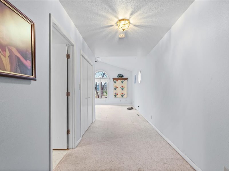 15742 Moody Road Oakland, IL 61943 - Photo 17 of 48 a view of a hallway with a chandelier fan