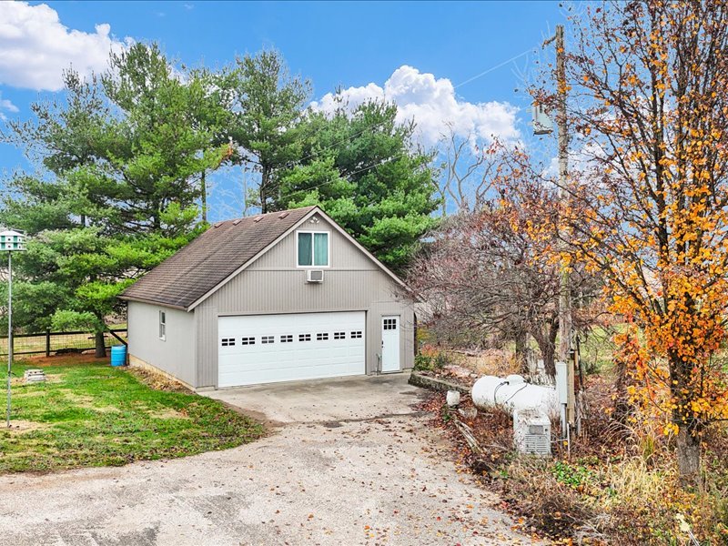 15742 Moody Road Oakland, IL 61943 - Photo 41 of 48 a view of a house with a yard and fence