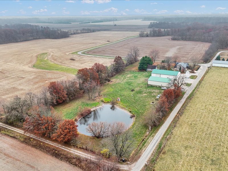 15742 Moody Road Oakland, IL 61943 - Photo 45 of 48 a view of a swimming pool with a yard and plants