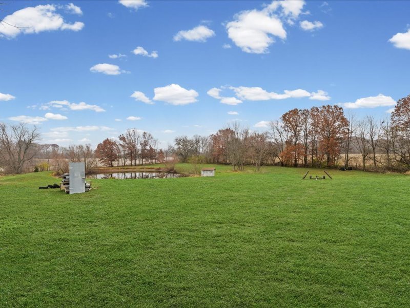 15742 Moody Road Oakland, IL 61943 - Photo 47 of 48 a view of a golf course with a lake