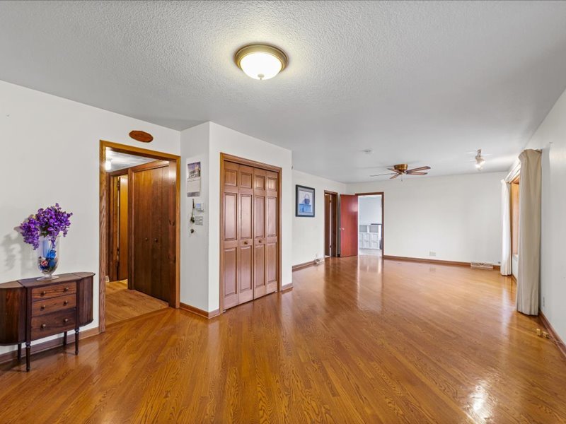 15742 Moody Road Oakland, IL 61943 - Photo 7 of 48 a view of empty room with wooden floor and fan
