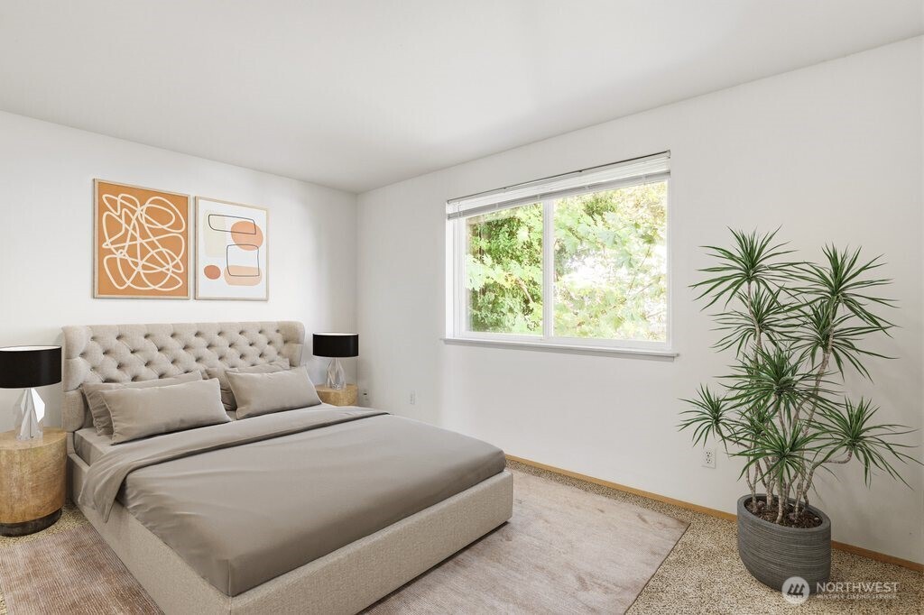 2800 Pine Road Northeast Bremerton, WA 98310 - Photo 29 of 38 a bedroom with a large bed and a potted plant