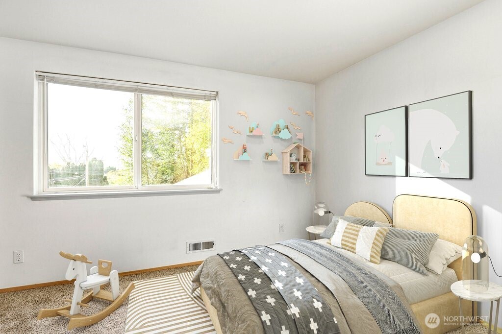 2800 Pine Road Northeast Bremerton, WA 98310 - Photo 31 of 38 a bedroom with a bed and wooden floor