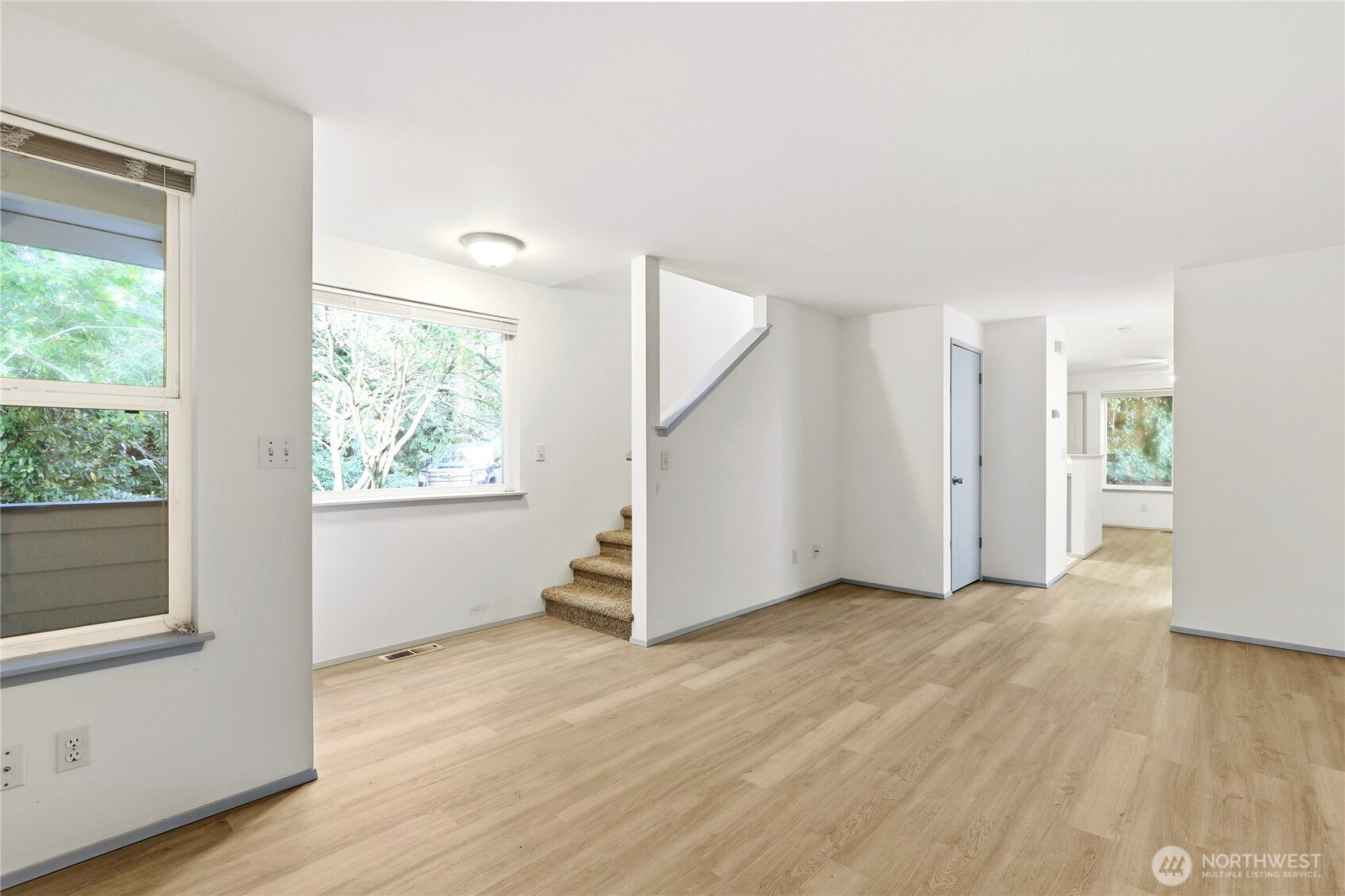 2800 Pine Road Northeast Bremerton, WA 98310 - Photo 5 of 38 a view of an empty room with wooden floor and a window