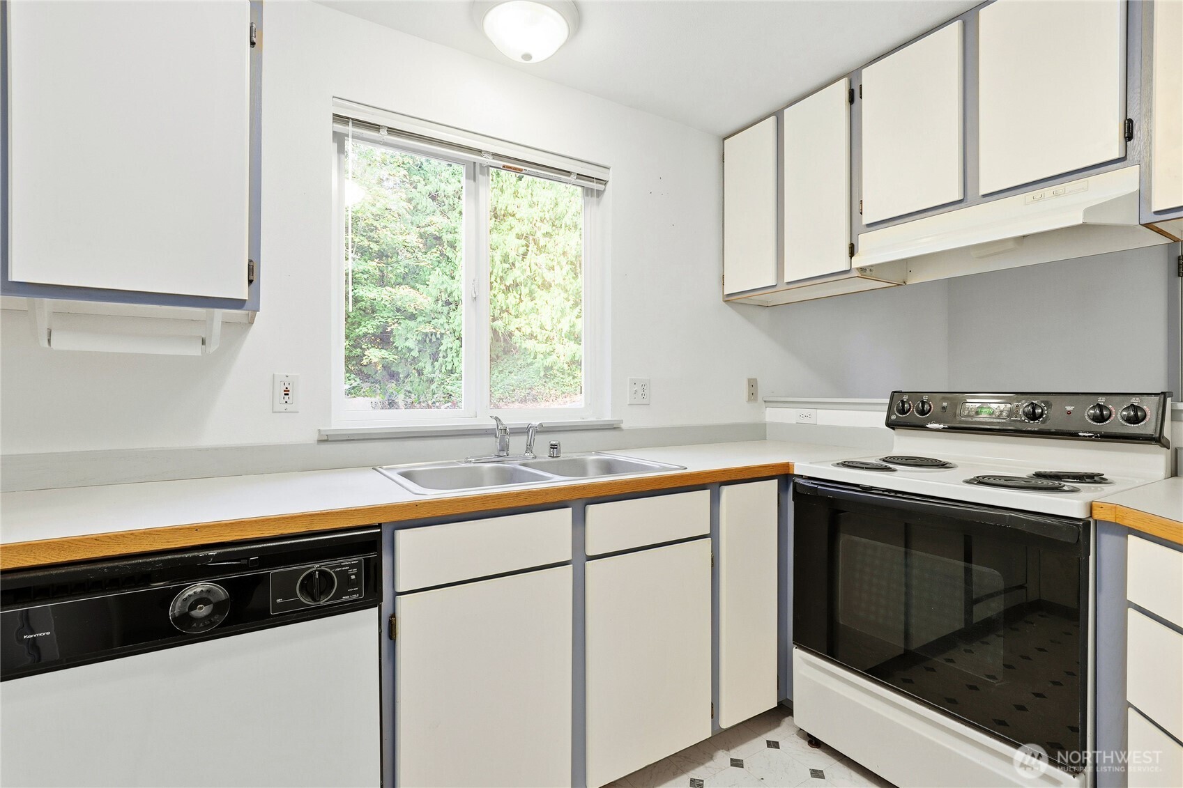 2800 Pine Road Northeast Bremerton, WA 98310 - Photo 7 of 38 a kitchen with a sink stove and cabinets