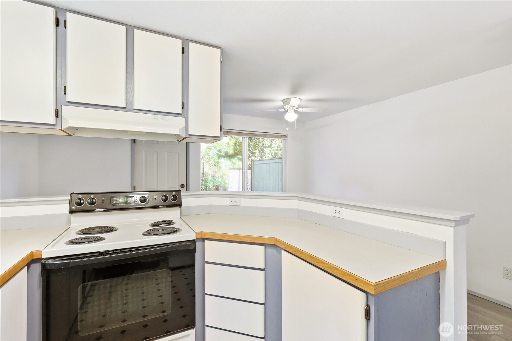 2800 Pine Road Northeast Bremerton, WA 98310 - Photo 8 of 38 a kitchen with a stove and a white cabinets