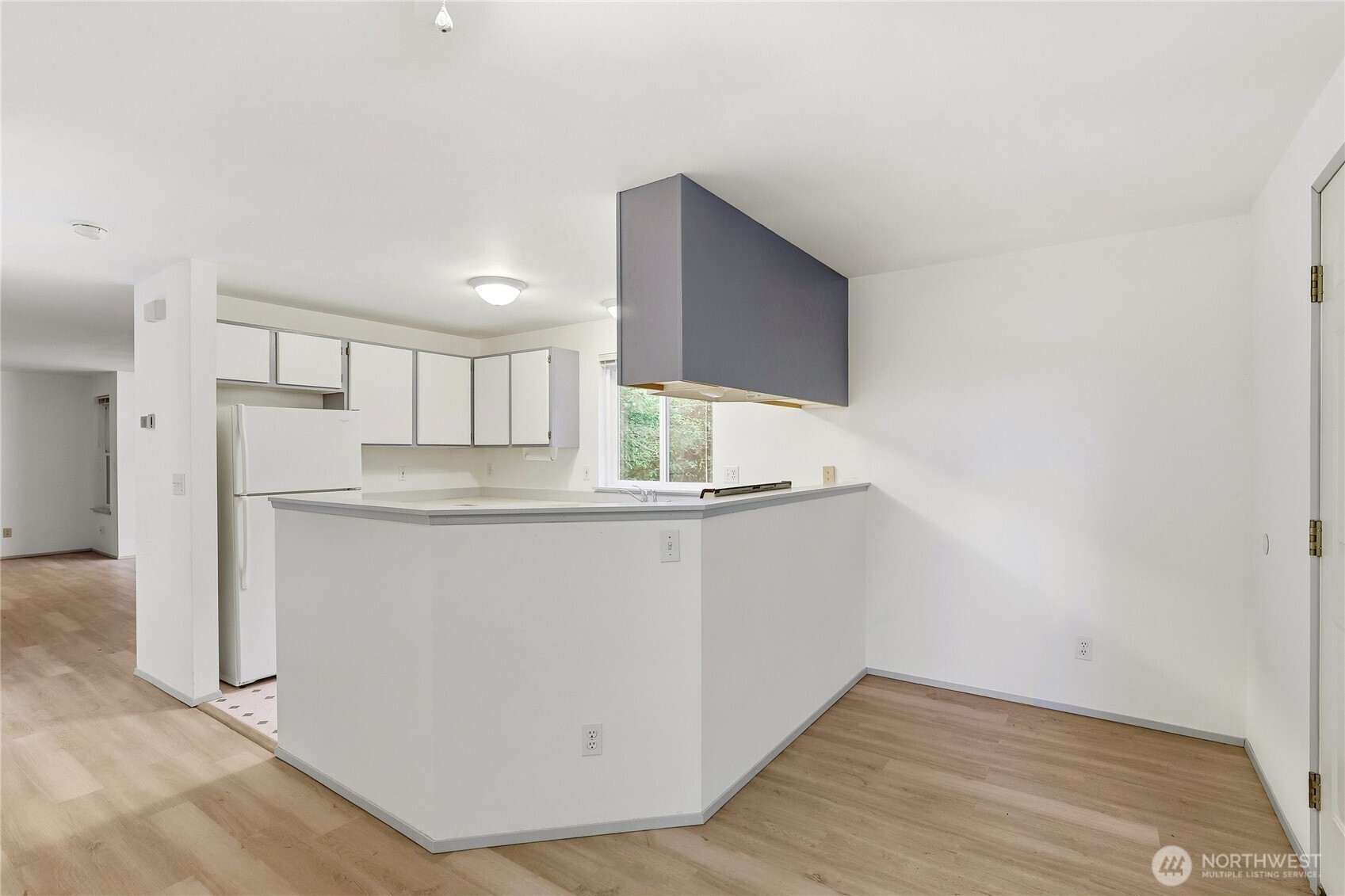 2800 Pine Road Northeast Bremerton, WA 98310 - Photo 9 of 38 a kitchen with white cabinets and refrigerator