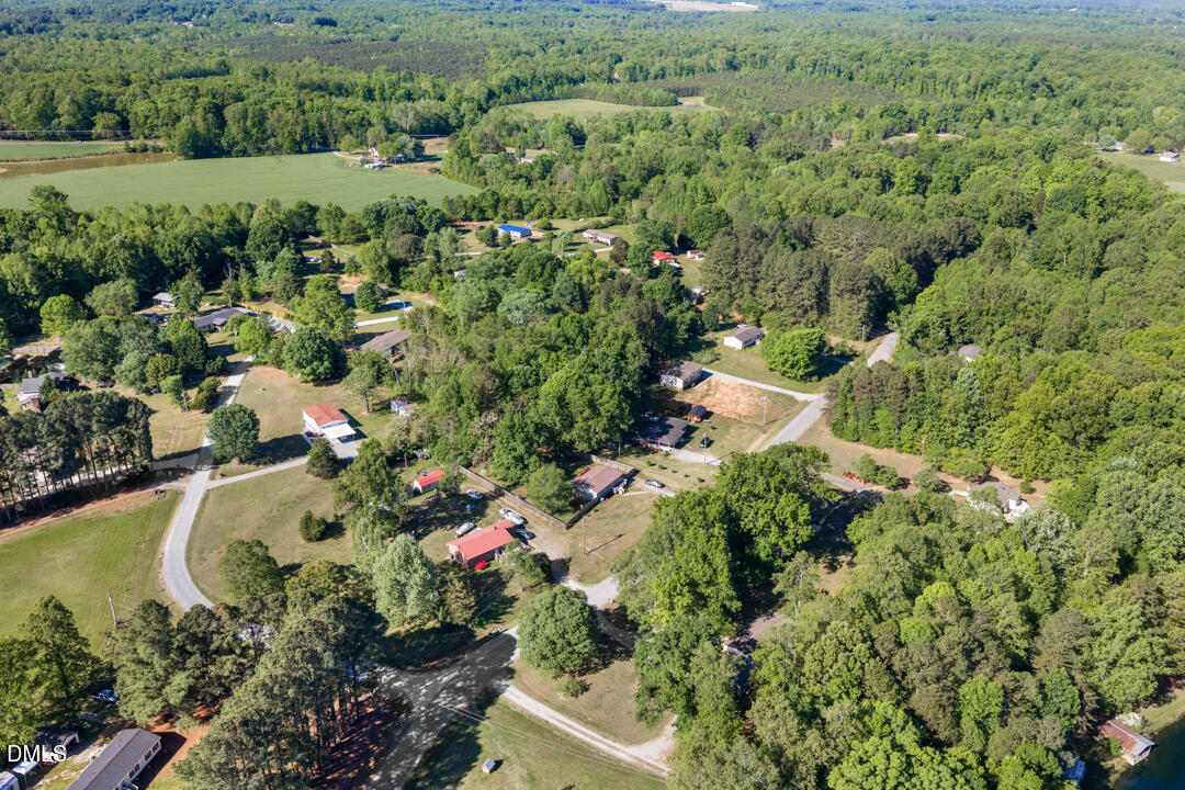 454 Cedar Creek Road Timberlake, NC 27583 - Photo 34 of 39 a view of a lake with a house