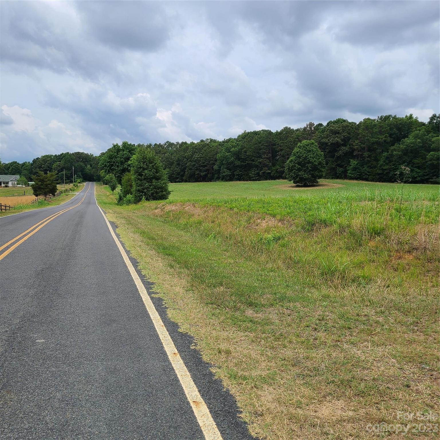 Approx 8.176-on Approx 8.176-on Tite Road Stanfield, NC 28163 - Photo 4 of 18 a view of a pathway both a yard both side of the lake