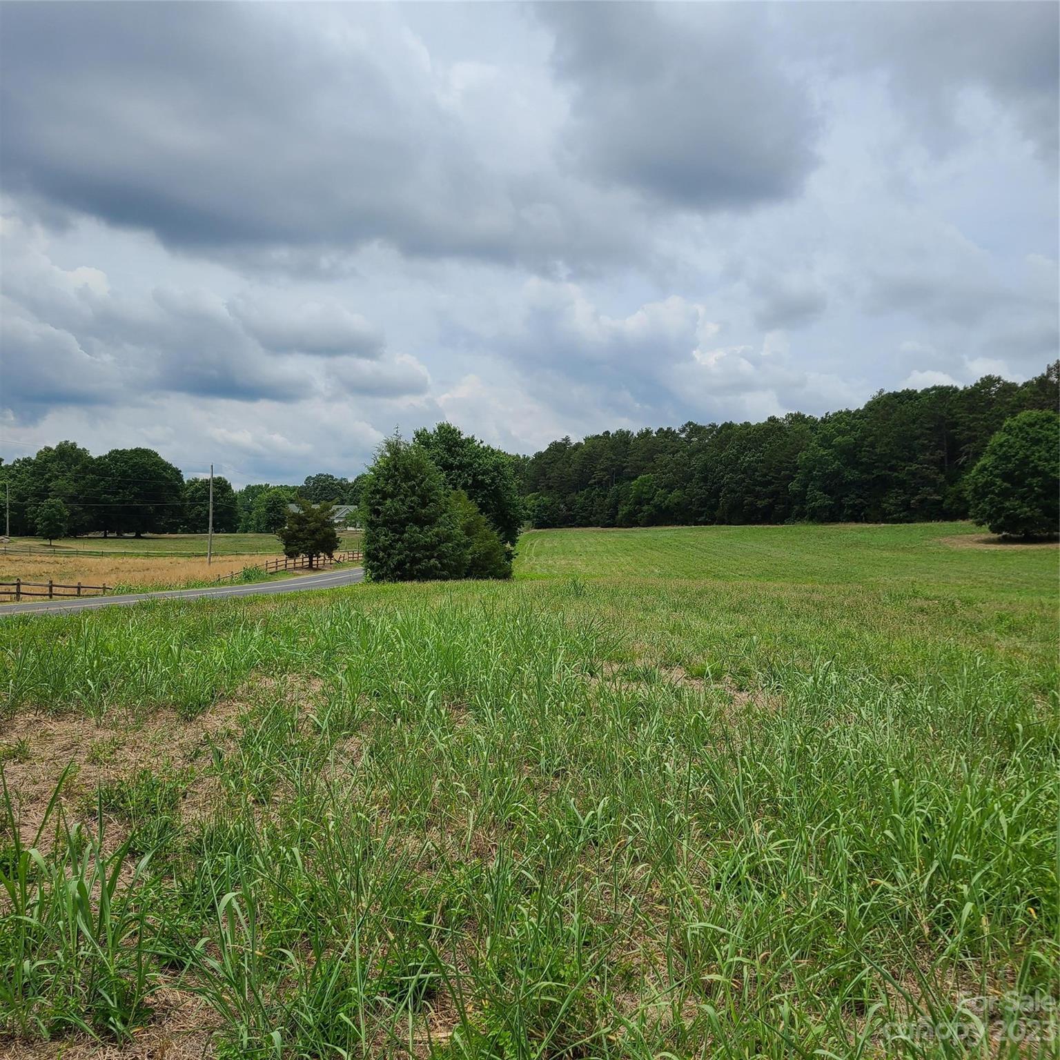 Approx 8.176-on Approx 8.176-on Tite Road Stanfield, NC 28163 - Photo 5 of 18 a view of a green field with wooden fence