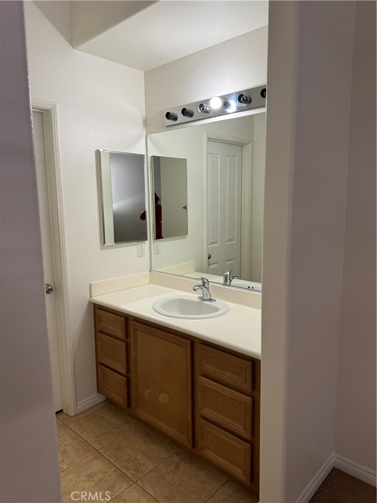 2986 Arbolitos Lane, Unit B Simi Valley, CA 93063 - Photo 19 of 36 a bathroom with a sink and a mirror