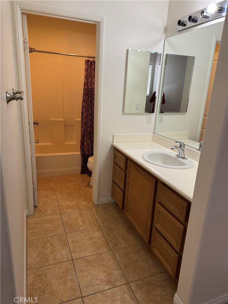 2986 Arbolitos Lane, Unit B Simi Valley, CA 93063 - Photo 20 of 36 a bathroom with a sink a mirror and shower