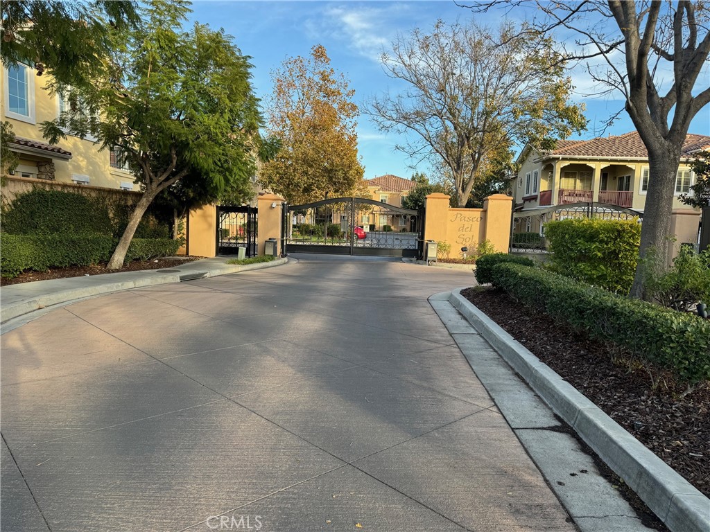 2986 Arbolitos Lane, Unit B Simi Valley, CA 93063 - Photo 25 of 36 a view of a street with trees on both side of it