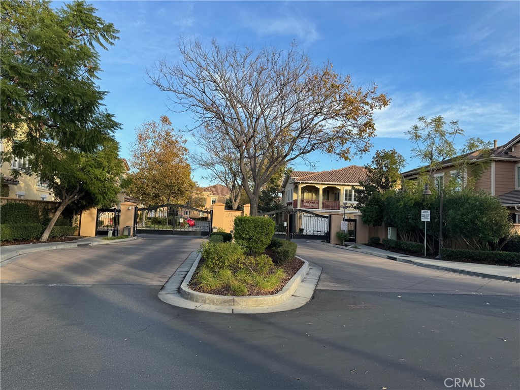 2986 Arbolitos Lane, Unit B Simi Valley, CA 93063 - Photo 26 of 36 a view of a house with a yard fire pit and potted plants