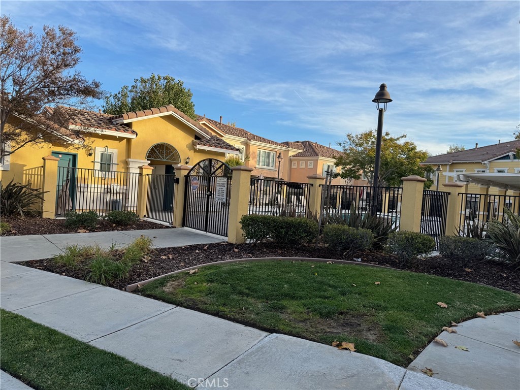 2986 Arbolitos Lane, Unit B Simi Valley, CA 93063 - Photo 33 of 36 a front view of a house with a yard