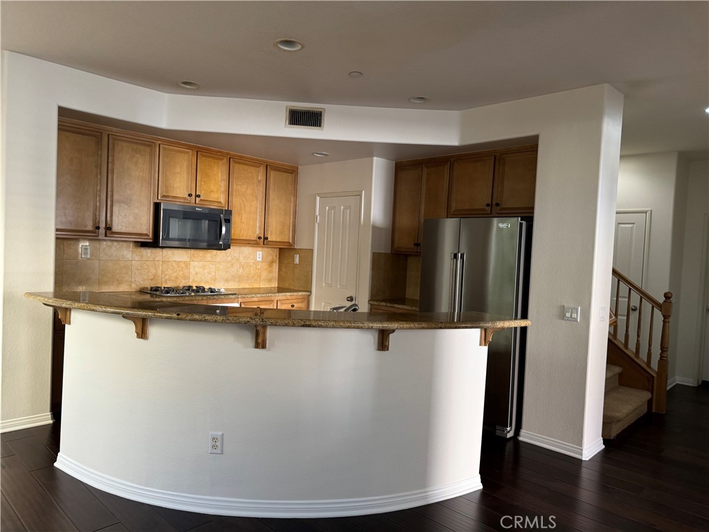 2986 Arbolitos Lane, Unit B Simi Valley, CA 93063 - Photo 5 of 36 a room with stainless steel appliances wooden floor and view living room