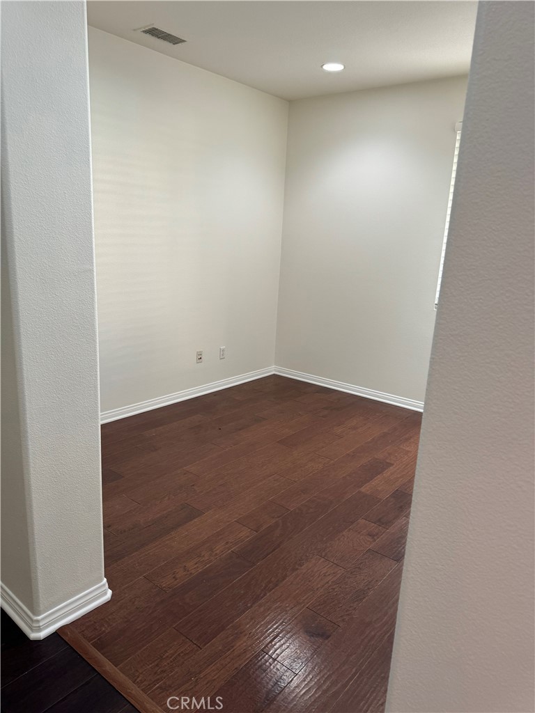 2986 Arbolitos Lane, Unit B Simi Valley, CA 93063 - Photo 8 of 36 an empty room with wooden floor