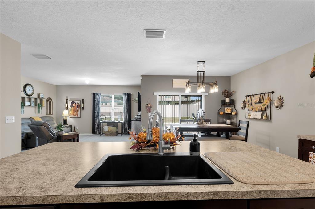 3016 Northeast 43rd Road Ocala, FL 34470 - Photo 11 of 35 a living room with kitchen furniture