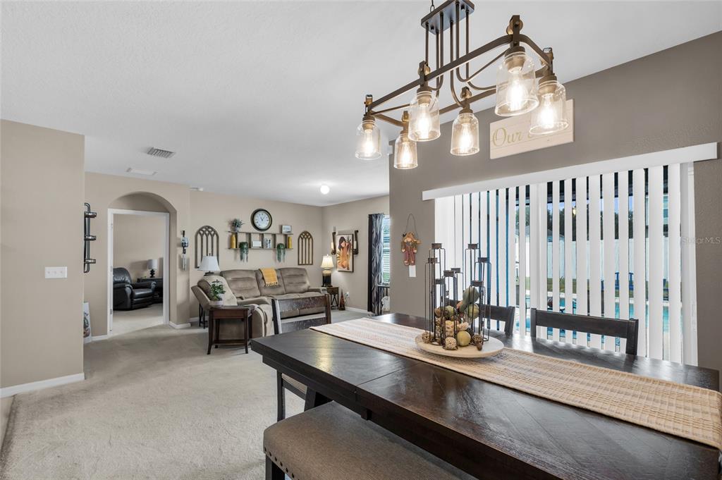 3016 Northeast 43rd Road Ocala, FL 34470 - Photo 12 of 35 a view of a dining room with furniture