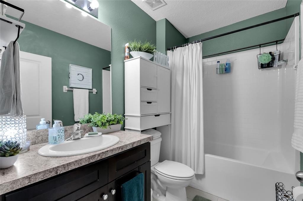 3016 Northeast 43rd Road Ocala, FL 34470 - Photo 16 of 35 a bathroom with a granite countertop sink toilet and shower
