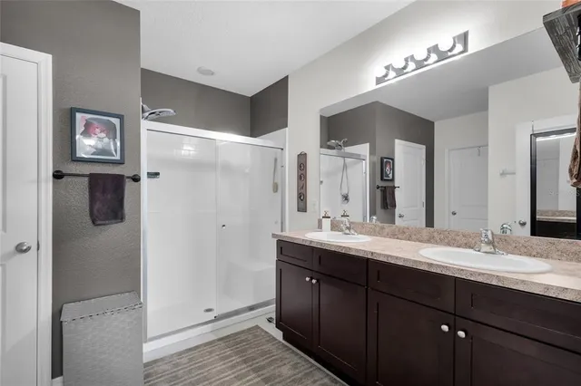 a white toilet sitting next to a bathroom sink