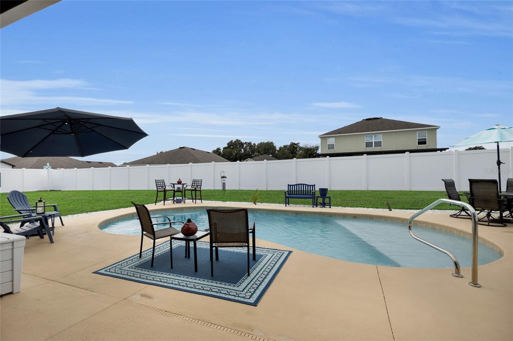 3016 Northeast 43rd Road Ocala, FL 34470 - Photo 25 of 35 a view of a swimming pool with a patio