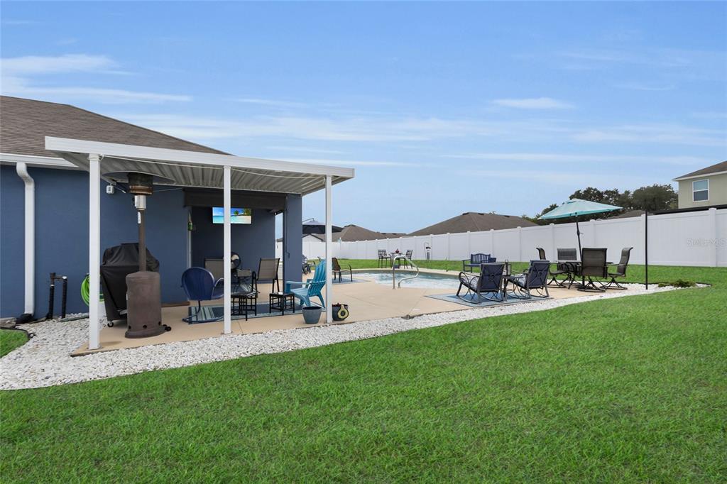 3016 Northeast 43rd Road Ocala, FL 34470 - Photo 27 of 35 a view of a house with backyard porch and sitting area